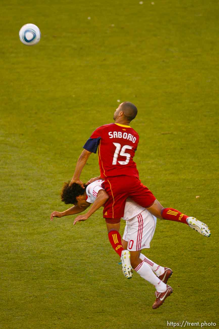 Trent Nelson  |  The Salt Lake Tribune
Real Salt Lake's Alvaro Saborio leaps over New York's Mehdi Ballouchy. Real Salt Lake vs. New York Red Bulls at Rio Tinto Stadium in Sandy, Utah. Saturday, August 6, 2011.