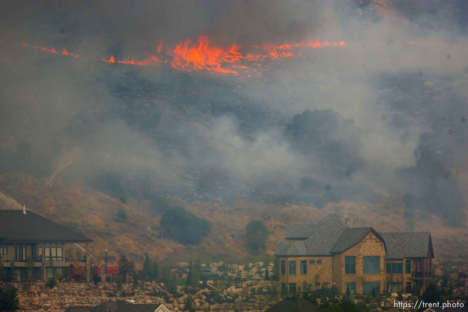 Trent Nelson  |  The Salt Lake Tribune
A smoky fire burns near homes in Draper, Utah, Saturday, August 13, 2011.