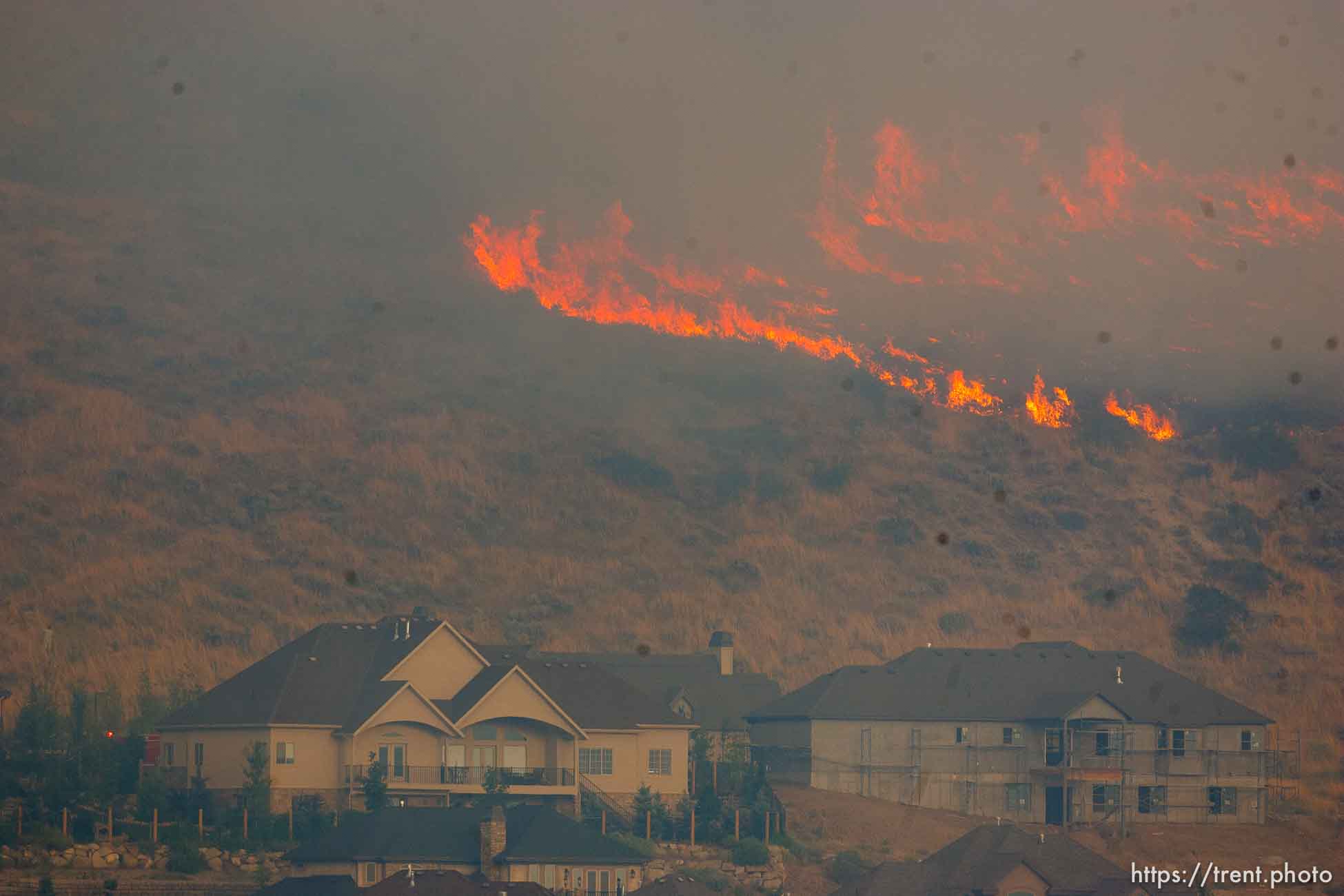 Trent Nelson  |  The Salt Lake Tribune
A smoky fire burns near homes in Draper, Utah, Saturday, August 13, 2011.