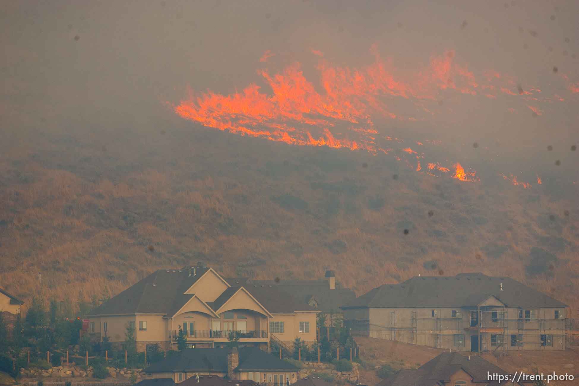 Trent Nelson  |  The Salt Lake Tribune
A smoky fire burns near homes in Draper, Utah, Saturday, August 13, 2011.