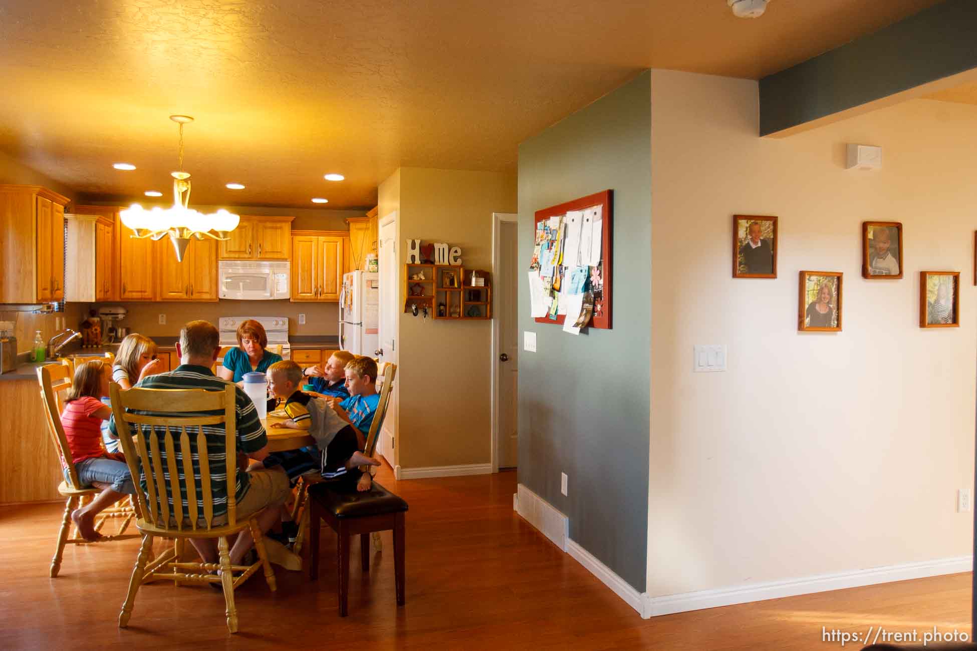 Trent Nelson  |  The Salt Lake Tribune
The Burton family gathers for dinner Thursday, August 25, 2011. The Burton family are trying to sell their home in Tooele, Utah, due to a job transfer. Despite adding more than $20,000 in improvements since they purchased their home in 2005, they are now asking only what they paid for the home. Left to right are Kaitlyn, Emily, Scott, Angela, Zachary, Spencer and Jeffrey Burton.