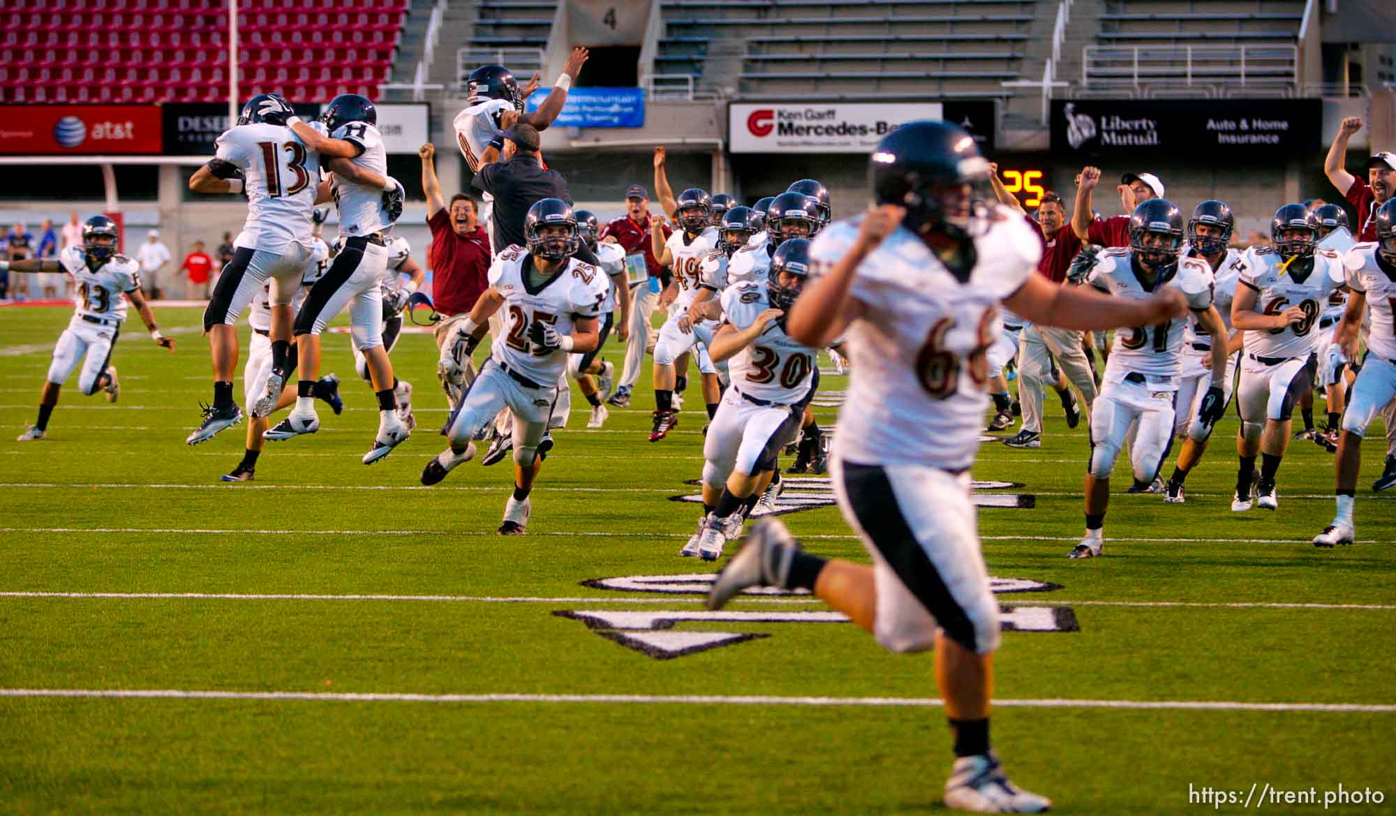 Trent Nelson  |  The Salt Lake Tribune
Herriman players and coaches storm the field after David Christensen pulled in the game-winning pass on a two-point conversion. Herriman vs. Riverton High School football at Rice-Eccles Stadium in Salt Lake City, Utah, Saturday, August 27, 2011.