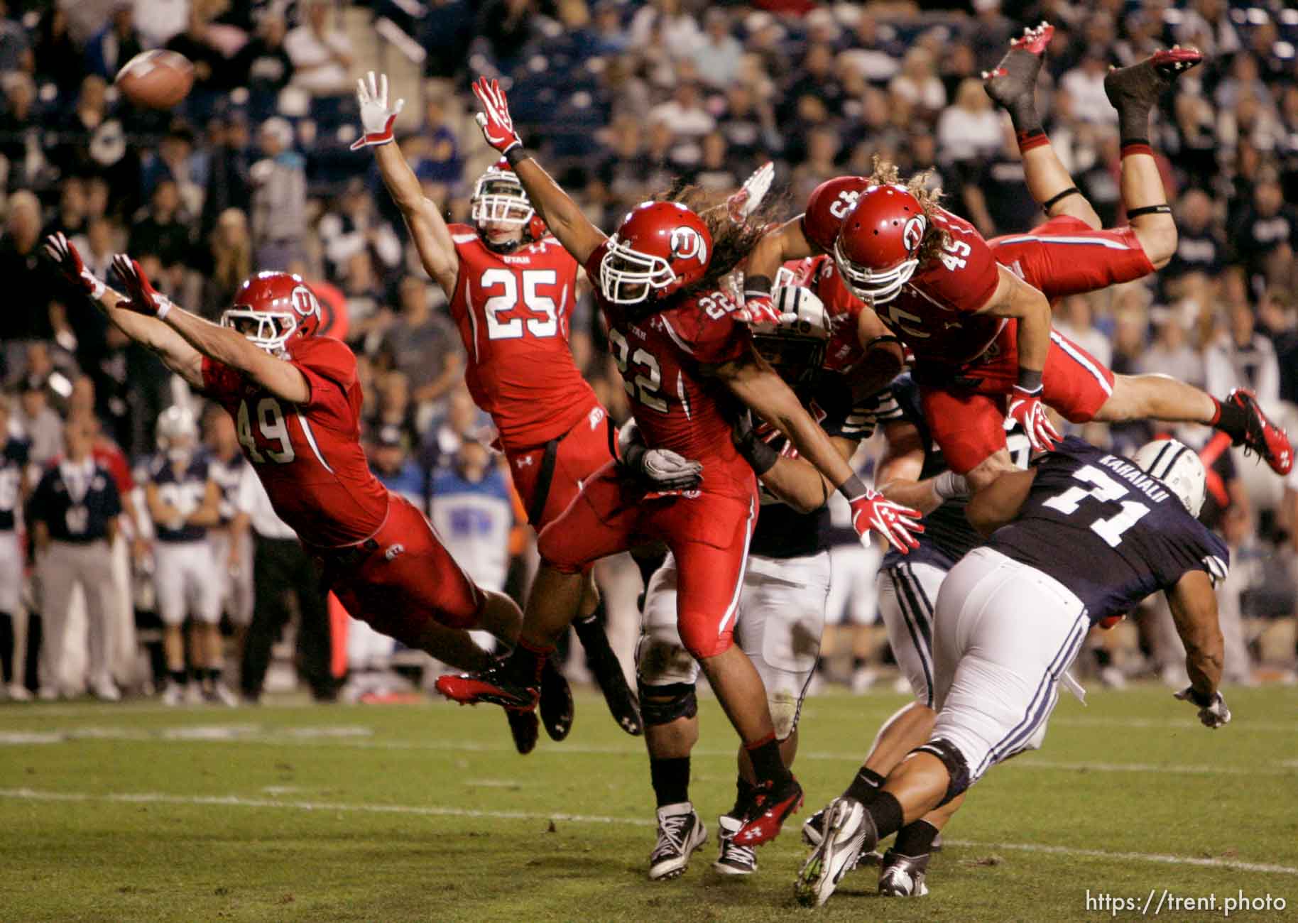 Trent Nelson  |  The Salt Lake Tribune
Utah punt block attempt, Utah's Trevor Reilly (49), Mike Honeycutt (25), Thretton Palamo (22), Boo Andersen (45). BYU vs. Utah football in Provo, Utah, Saturday, September 17, 2011.