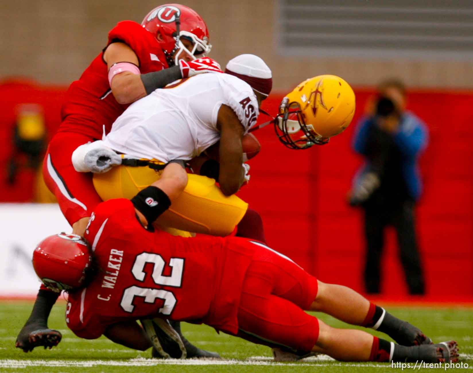 Trent Nelson  |  The Salt Lake Tribune
Utah linebacker Brian Blechen, left, knocks the helmet off Arizona State's Gerell Robinson during the second half, Utah vs. Arizona State, college football at Rice-Eccles Stadium in Salt Lake City, Utah, Saturday, October 8, 2011. Chaz Walker is 32.