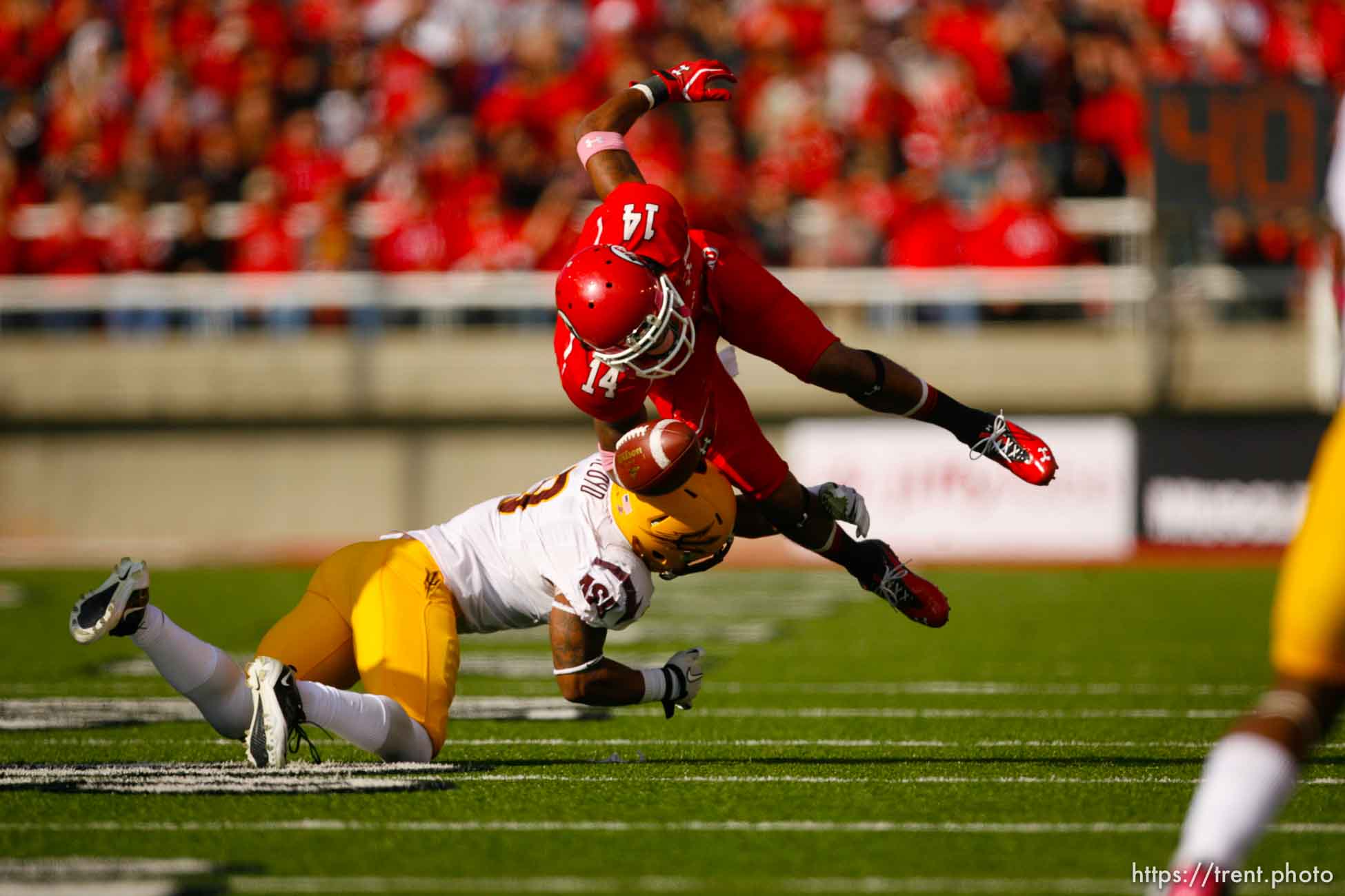 Trent Nelson  |  The Salt Lake Tribune
Utah receiver Reggie Dunn fumbles the ball as he's hit by Arizona State safety Clint Floyd in the second half, Utah vs. Arizona State, college football at Rice-Eccles Stadium in Salt Lake City, Utah, Saturday, October 8, 2011.