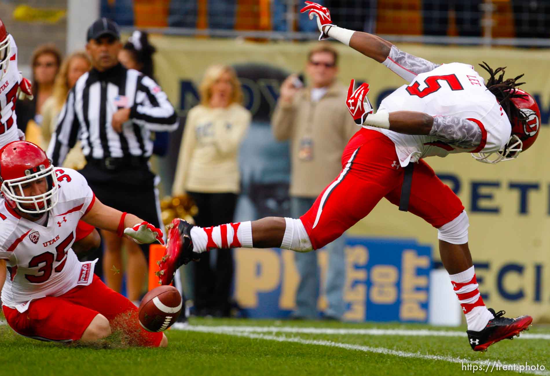 Trent Nelson  |  The Salt Lake Tribune
Utah's Greg Bird (35) and Mo Lee (5) down a punt at the one-yard line during the first half. Utah vs. Pitt, college football at Heinz Field Stadium in Pittsburgh, Pennsylvania, Saturday, October 15, 2011.