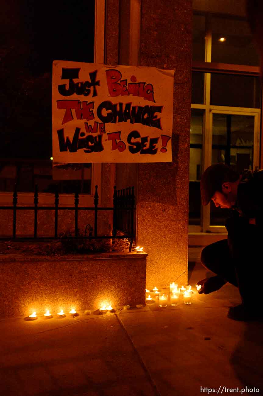 Trent Nelson  |  The Salt Lake Tribune
Justin Kramer lights candles in front of the Public Safety Building in Salt Lake City, Utah on Wednesday, October 26, 2011. About two dozen protesters with Occupy Salt Lake marched from Pioneer Park to the Public Safety Building. They lit candles to show appreciation for the Salt Lake City police, but to protest the actions of the police in Oakland (California).