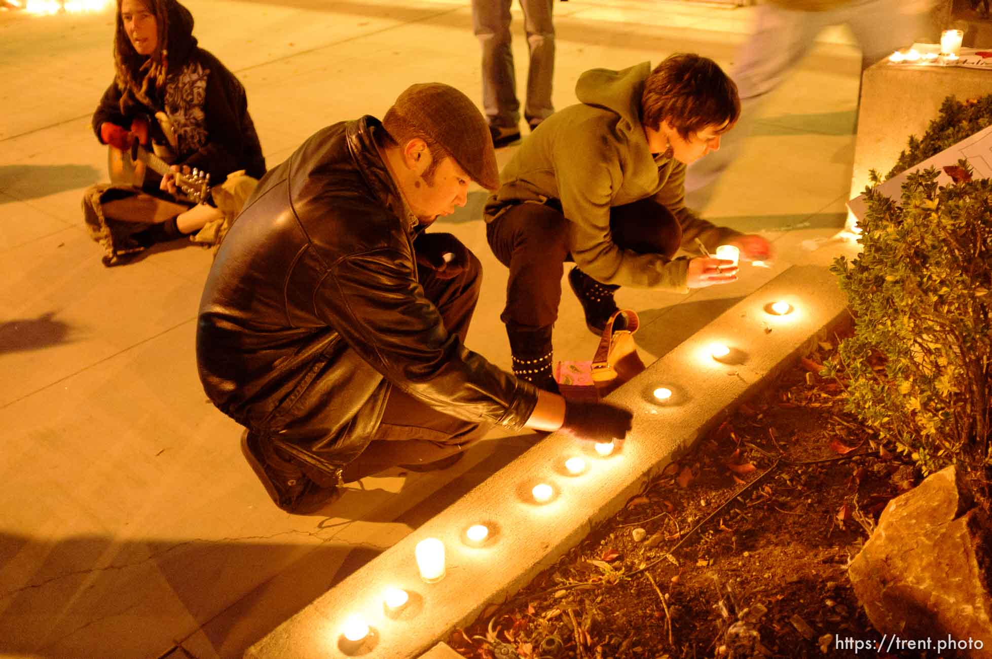 Trent Nelson  |  The Salt Lake Tribune
Justin Kramer lights candles in front of the Public Safety Building in Salt Lake City, Utah on Wednesday, October 26, 2011. About two dozen protesters with Occupy Salt Lake marched from Pioneer Park to the Public Safety Building. They lit candles to show appreciation for the Salt Lake City police, but to protest the actions of the police in Oakland (California).