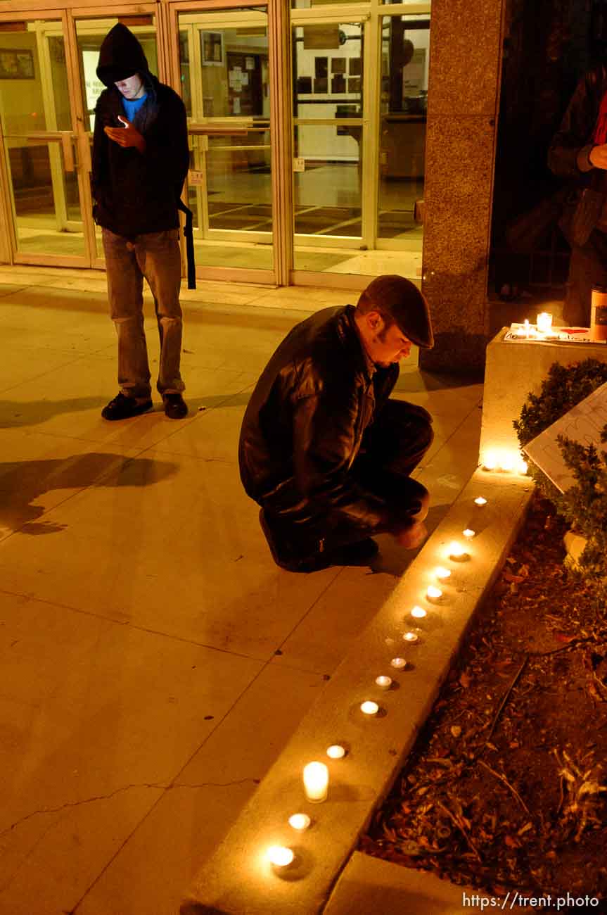 Trent Nelson  |  The Salt Lake Tribune
Justin Kramer lights candles in front of the Public Safety Building in Salt Lake City, Utah on Wednesday, October 26, 2011. About two dozen protesters with Occupy Salt Lake marched from Pioneer Park to the Public Safety Building. They lit candles to show appreciation for the Salt Lake City police, but to protest the actions of the police in Oakland (California).