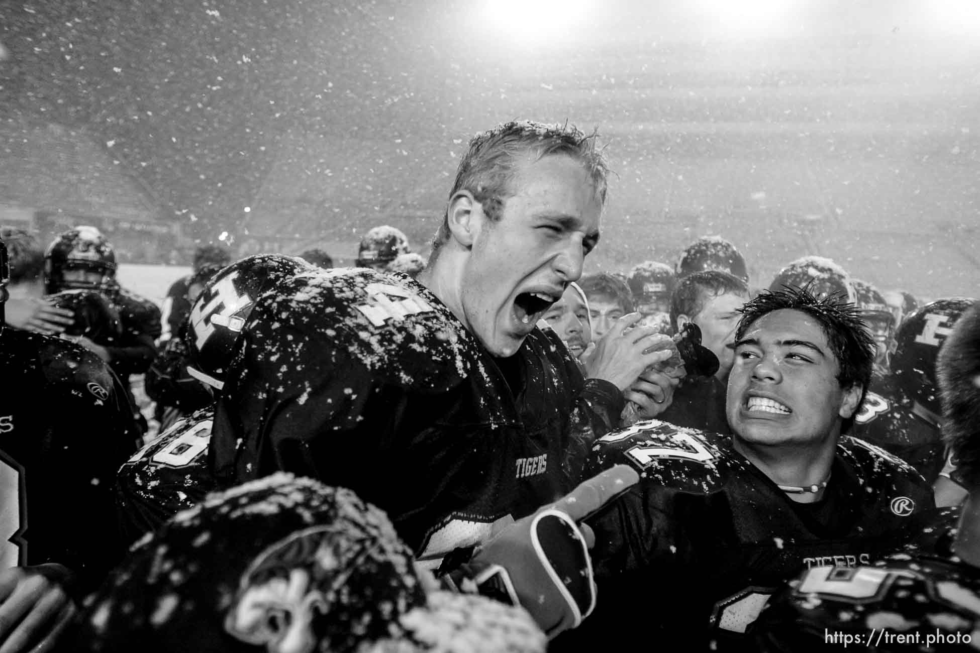 Trent Nelson  |  The Salt Lake Tribune
Hurricane's Colton Marshall, left, shares a yell with teammate Joseph Takau after Hurricane defeated Desert Hills 21-0 in the 3A State Championship high school football game at Rice-Eccles Stadium in Salt Lake City, Utah, Friday, November 18, 2011.