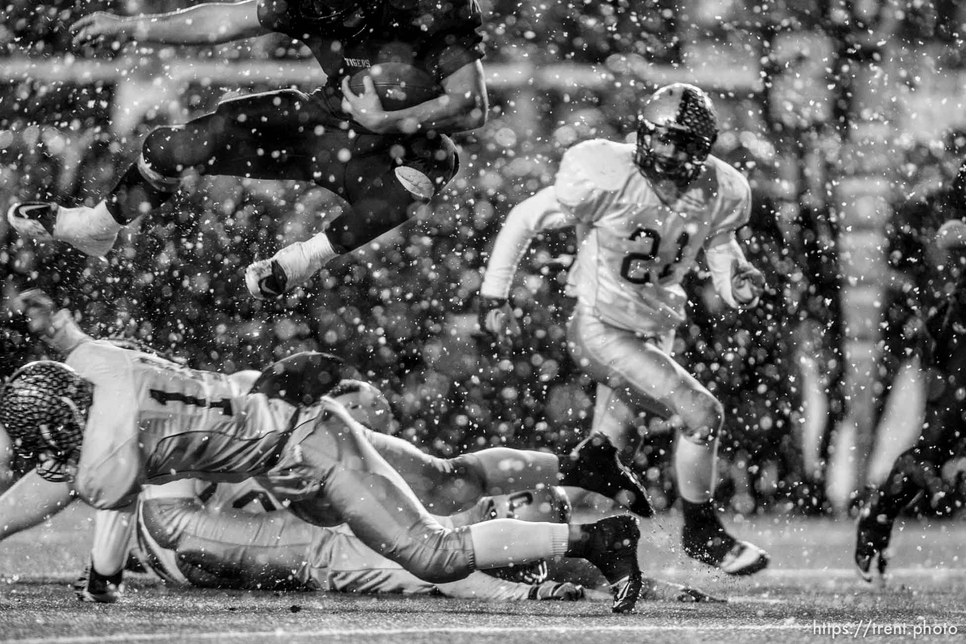 Trent Nelson  |  The Salt Lake Tribune
Hurricane vs. Desert Hills in the 3A State Championship high school football game at Rice-Eccles Stadium in Salt Lake City, Utah, Friday, November 18, 2011. Brian Scott leaps over defense