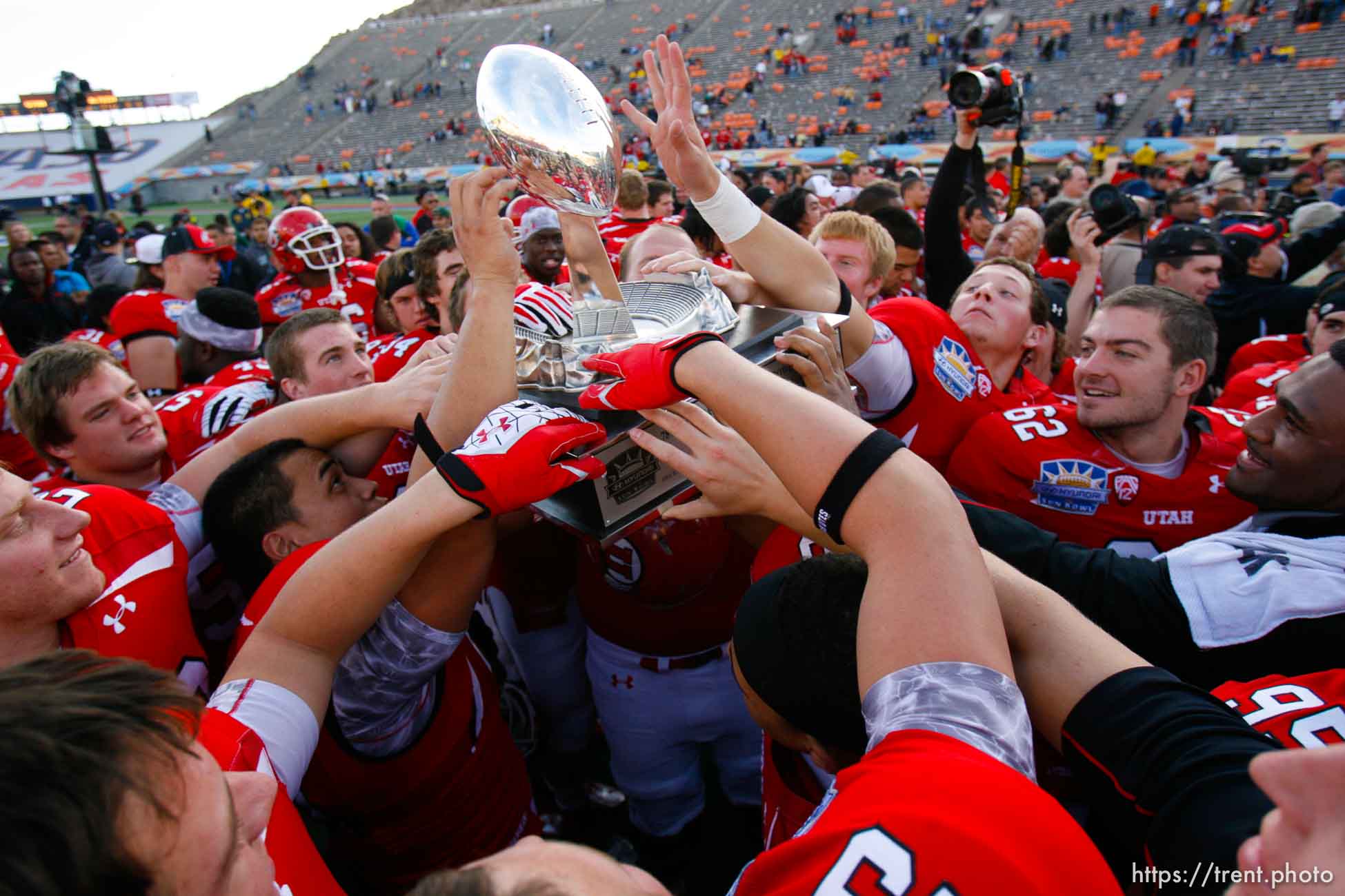 Trent Nelson  |  The Salt Lake Tribune
Utah players celebrate with the trophy as the University of Utah defeated Georgia Tech, college football at the Sun Bowl in El Paso, Texas, Saturday, December 31, 2011.