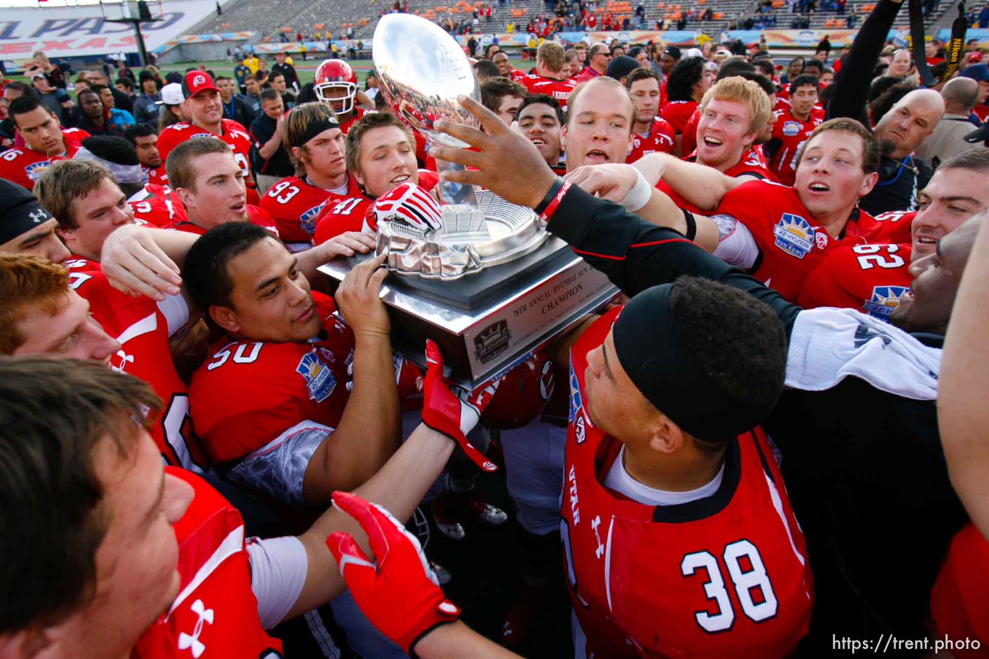 Trent Nelson  |  The Salt Lake Tribune
Utah players celebrate with the trophy as the University of Utah defeated Georgia Tech, college football at the Sun Bowl in El Paso, Texas, Saturday, December 31, 2011.