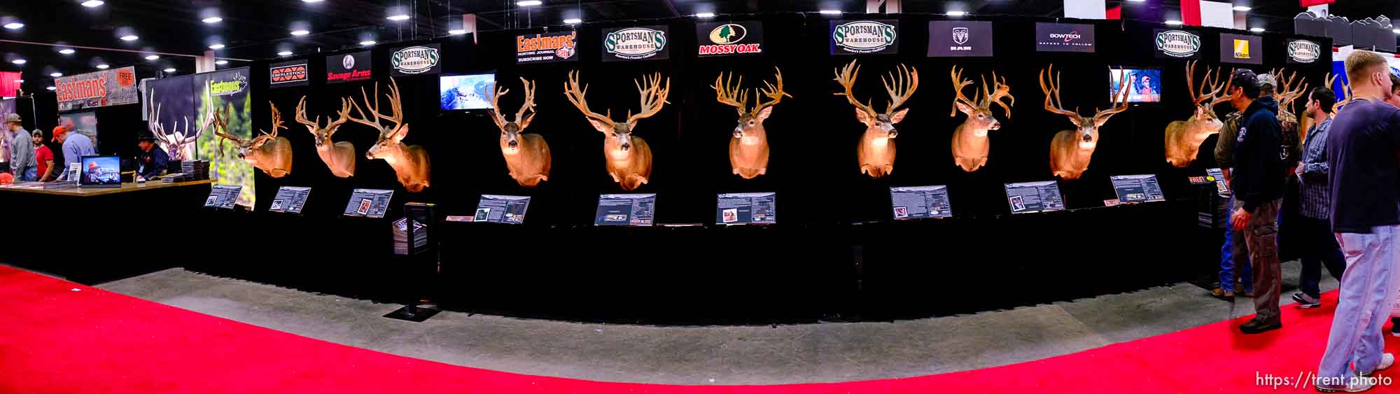 Expo attendees walk past Eastmans' 2012 Trophy Deer Tour display at the International Sportsmen's Exposition Saturday, March 17, 2012 at the South Towne Exposition Center in Sandy, Utah.