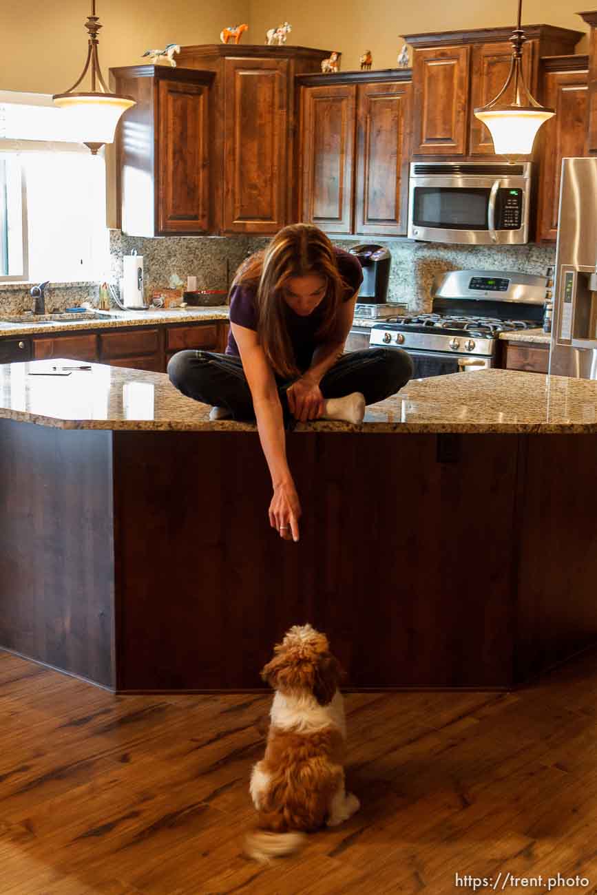 Trent Nelson  |  The Salt Lake Tribune
Jen Carver points down to one of her dogs, Charlie Dragon Superhero, Thursday, March 29, 2012 in Ogden, Utah. U.S. Army veteran Jen Carver served two tours in Iraq and is now a full time college student with an on-campus job while raising her 4-year-old son.