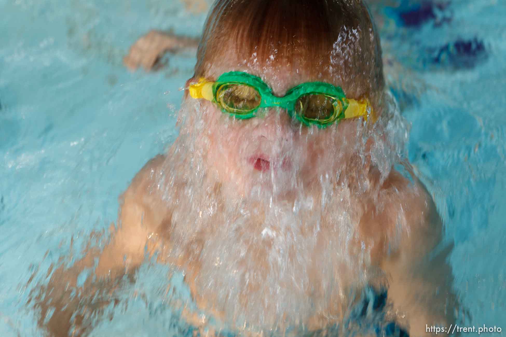 Trent Nelson  |  The Salt Lake Tribune
Oliver Pelton leaps up from the bottom of the pool while taking swim lessons as part of the Race Swami program at the Northwest Recreation Center Wednesday, April 25, 2012 in Salt Lake City, Utah. Race Swami is an outreach program that teaches kids in Rose Park and Glendale to swim, but also introduces kids to overall physical wellness and gives them social direction and help when needed. There are about 50 kids in the program, and all of the coaches are volunteers.