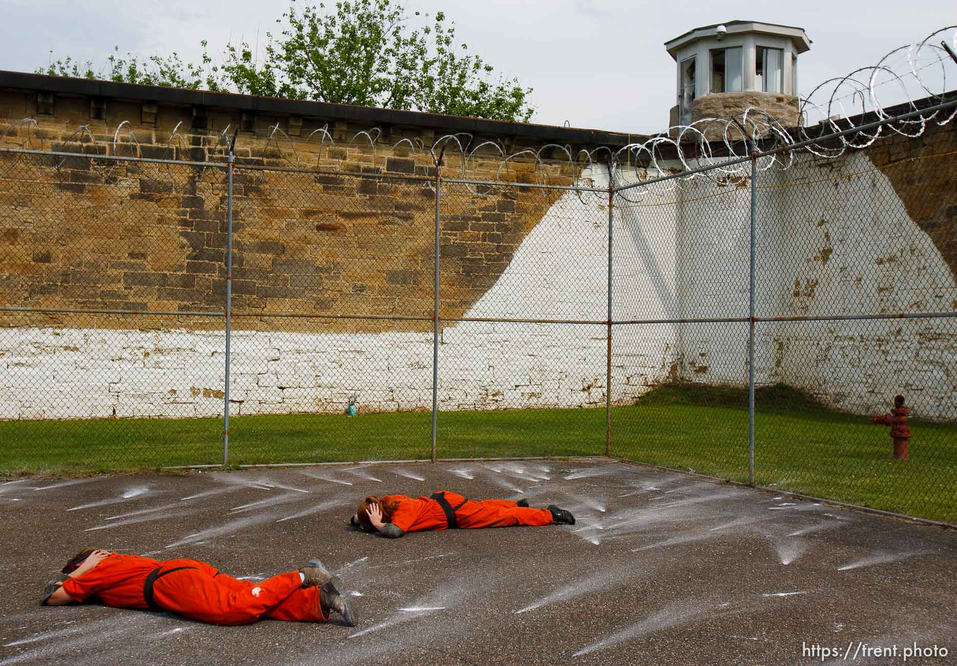 Trent Nelson  |  The Salt Lake Tribune
Weber State students Rachel Taylor, left, and Sarah Cleverley lie prone, role playing as inmates while an emergency response team from the Chemung County (NY) Sheriff's Office moves in during a training scenario at the Mock Prison Riot, Monday, May 7, 2012 at the West Virginia Penitentiary in Moundsville, West Virginia.