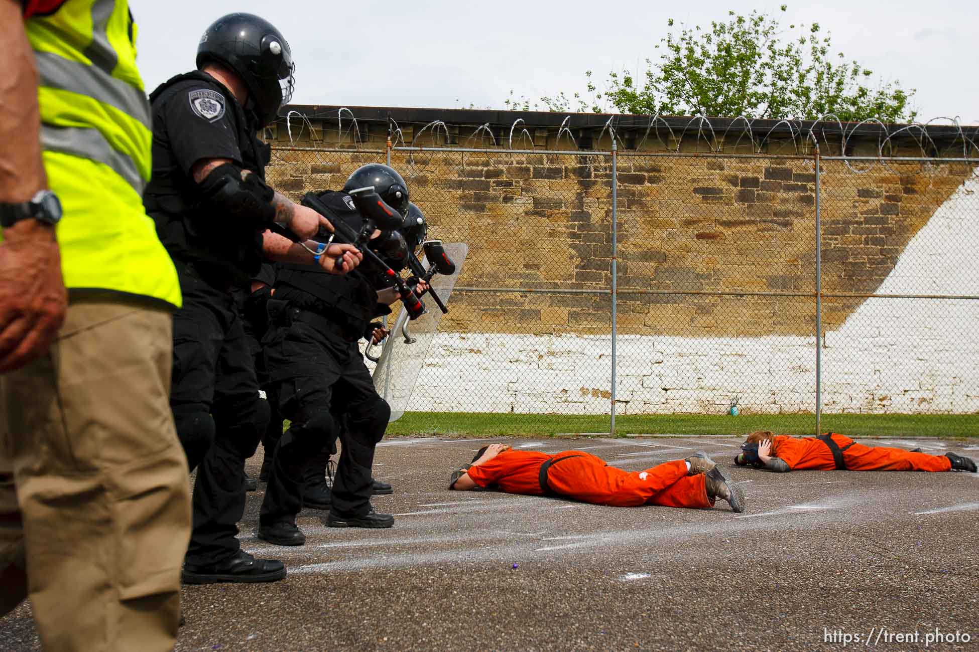 Trent Nelson  |  The Salt Lake Tribune
Weber State students Rachel Taylor, left, and Sarah Cleverley lie prone, role playing as inmates while an emergency response team from the Chemung County (NY) Sheriff's Office moves in during a training scenario at the Mock Prison Riot, Monday, May 7, 2012 at the West Virginia Penitentiary in Moundsville, West Virginia.