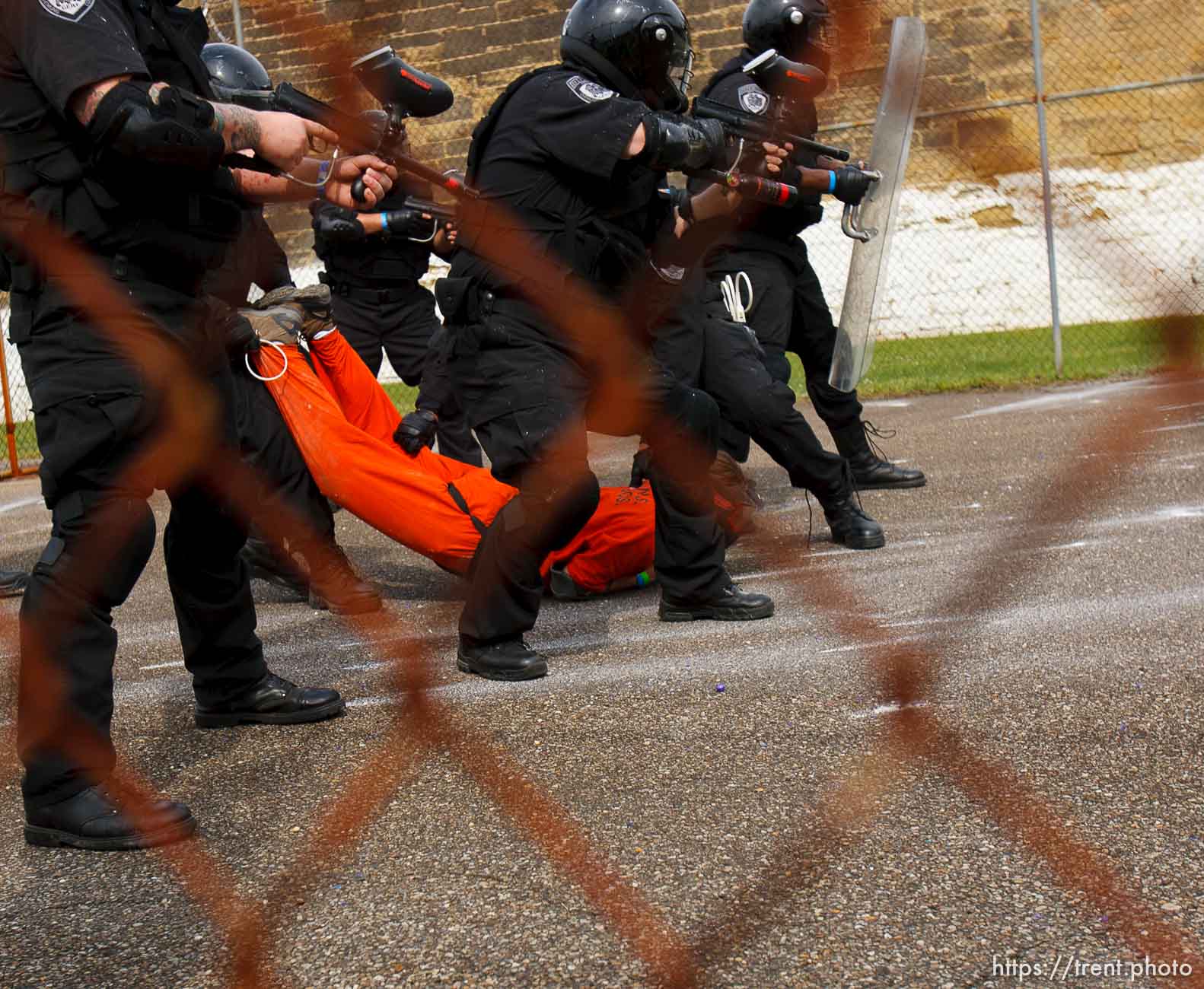 Trent Nelson  |  The Salt Lake Tribune
Weber State student Rachel Taylor, role playing as an inmate, is subdued by an emergency response team from the Chemung County (NY) Sheriff's Office during a training scenario at the Mock Prison Riot, Monday, May 7, 2012 at the West Virginia Penitentiary in Moundsville, West Virginia.