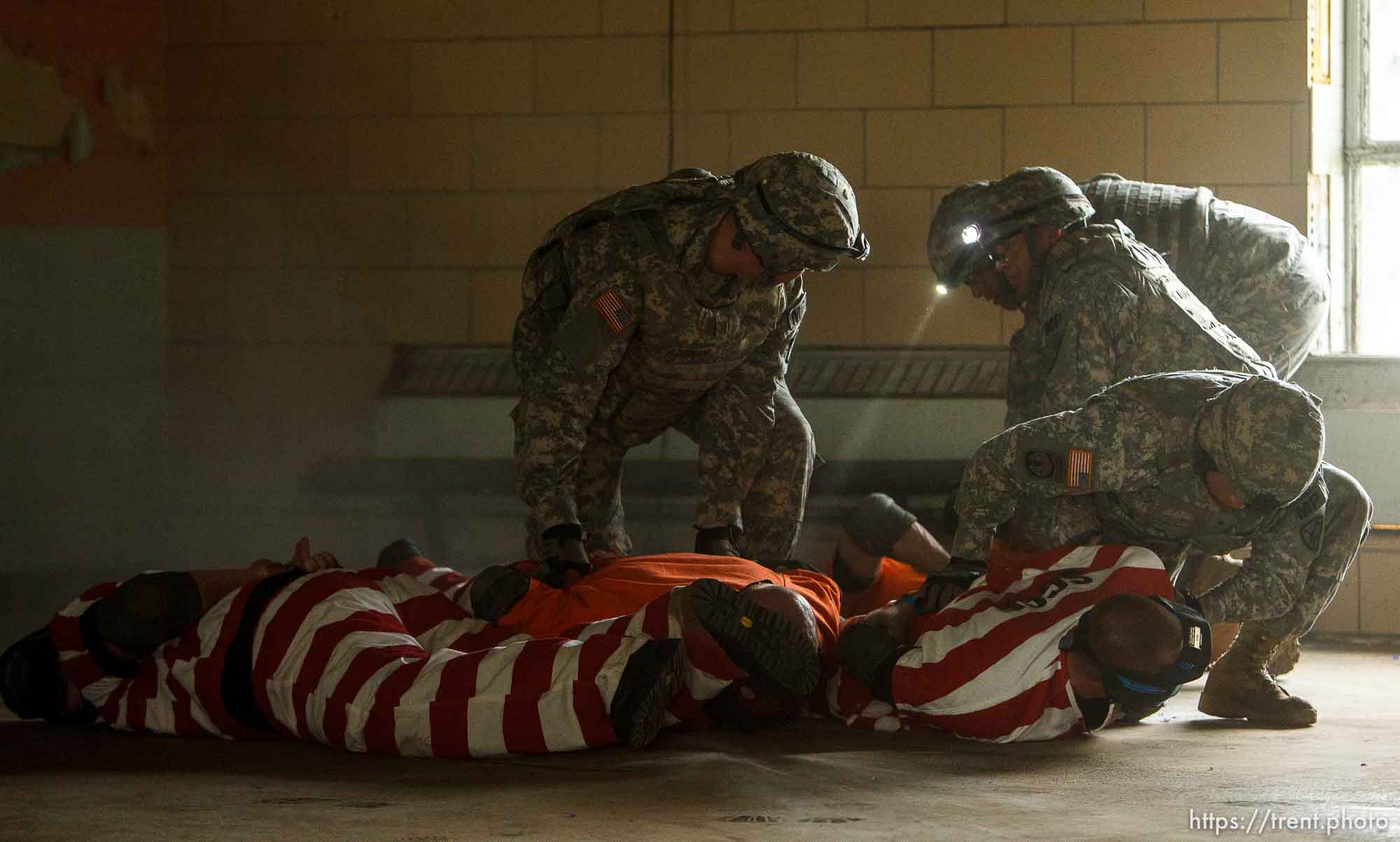 Trent Nelson  |  The Salt Lake Tribune
An emergency response team comprised of Army military police subdues volunteers role playing as inmates during a training scenario at the Mock Prison Riot, Monday, May 7, 2012 at the West Virginia Penitentiary in Moundsville, West Virginia.