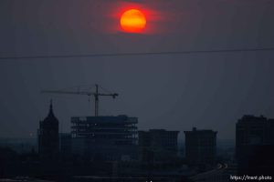 Trent Nelson  |  The Salt Lake Tribune
The setting sun burns through the haze over Salt Lake City, Utah Thursday, August 16, 2012.