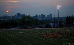 Trent Nelson  |  The Salt Lake Tribune
The setting sun burns through the haze over Salt Lake City, Utah Thursday, August 16, 2012.