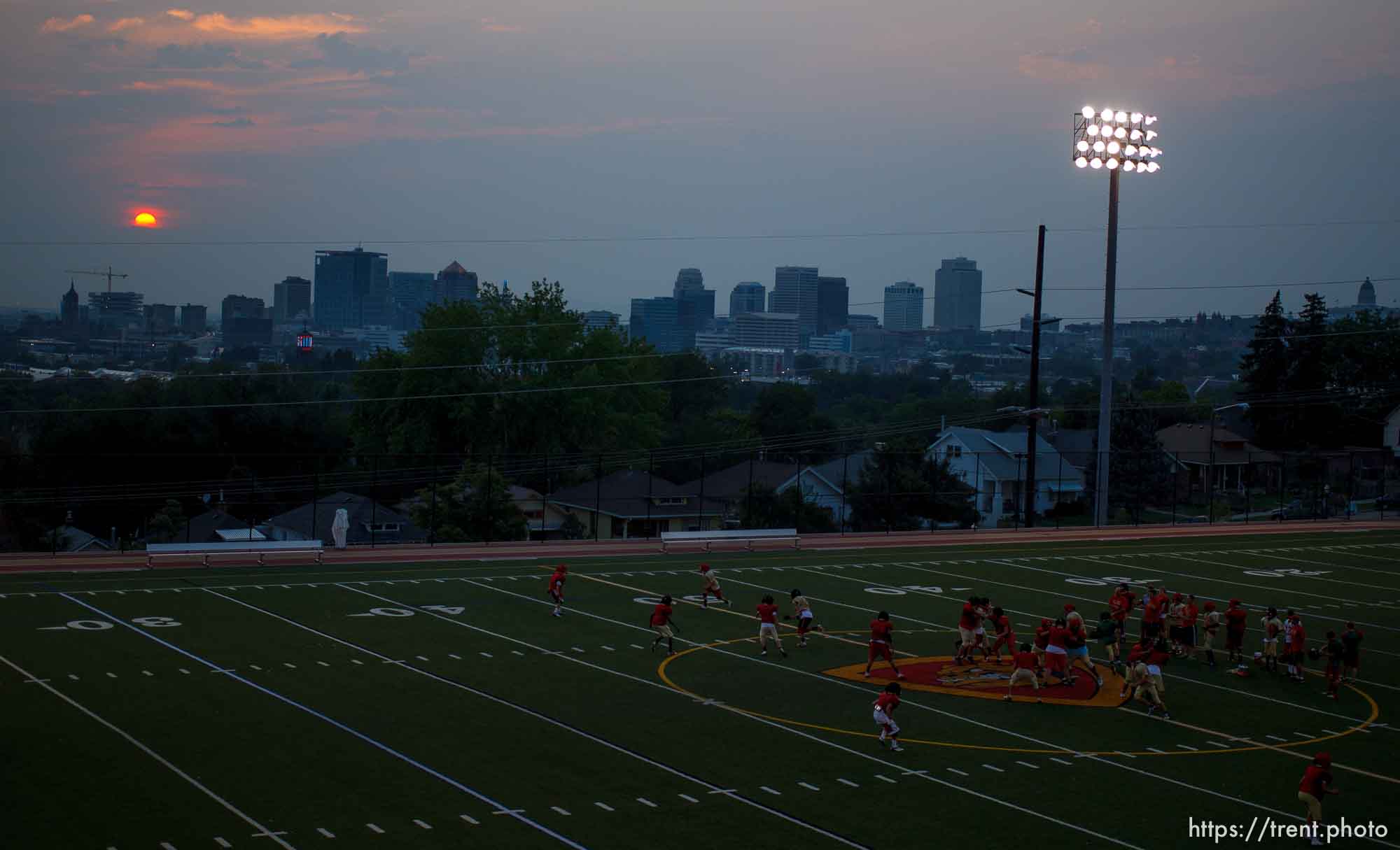 Trent Nelson  |  The Salt Lake Tribune
The setting sun burns through the haze over Salt Lake City, Utah Thursday, August 16, 2012.