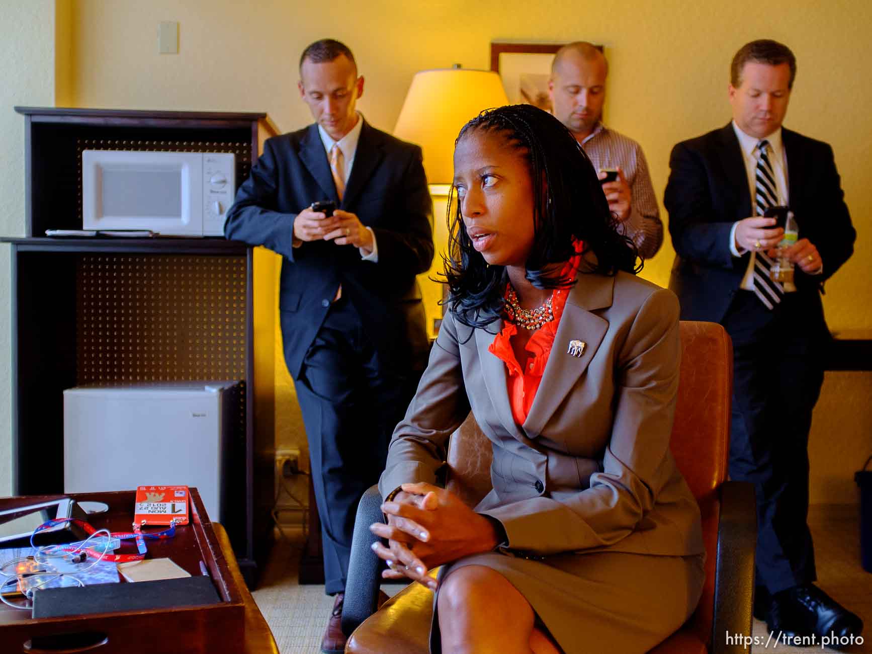 Trent Nelson  |  The Salt Lake Tribune
Utah Congressional candidate Mia Love, answers interview questions at the Sheraton Hotel in Tampa, Florida, Monday, August 27, 2012, the day before the Republican National Convention kicks off. At rear, left to right, are Love's husband Jason Love and campaign staffers Steve Hunter and Boyd Matheson.