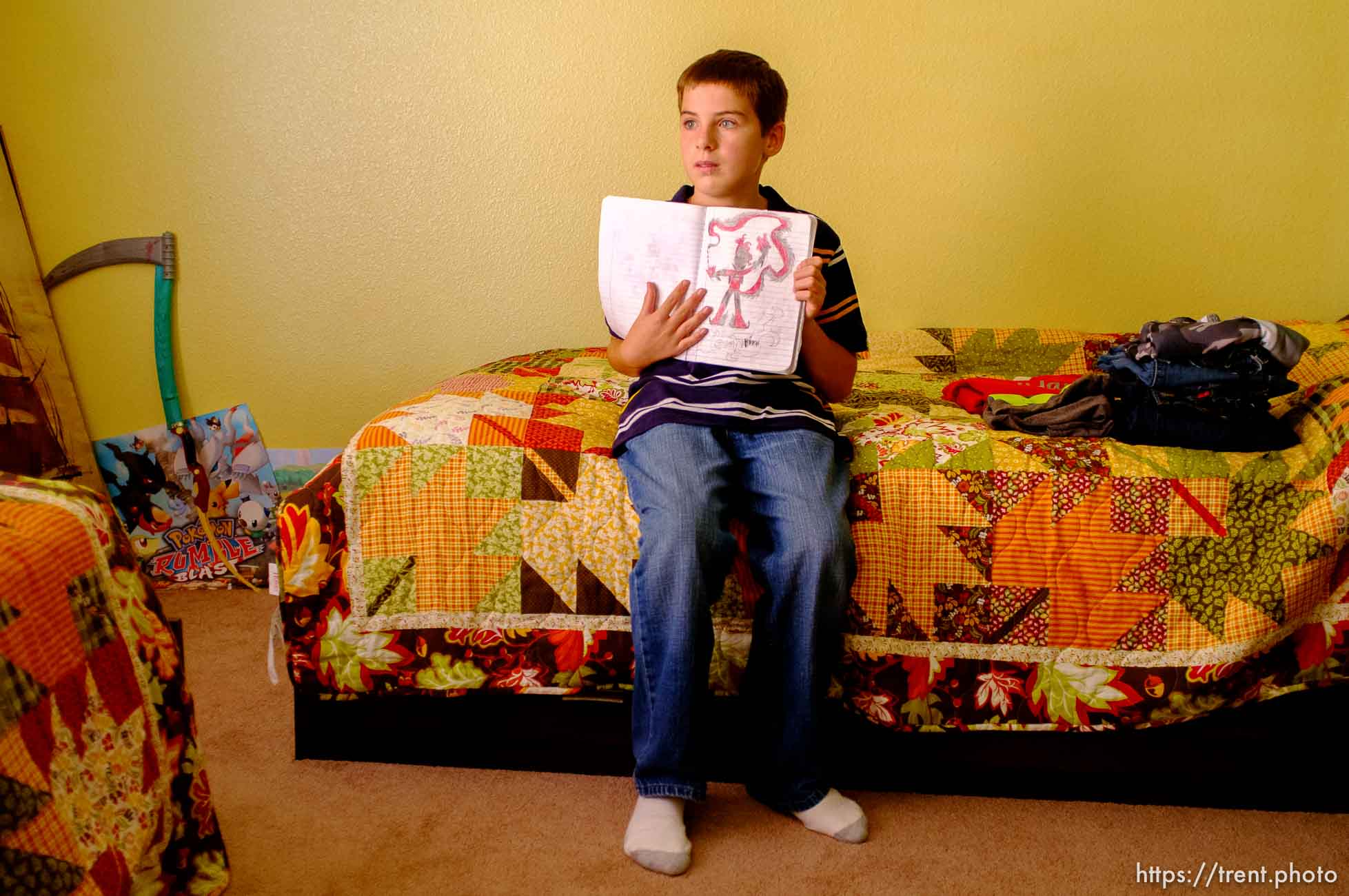 Trent Nelson  |  The Salt Lake Tribune
Michael Chambers with some of his artwork at the foster home where he lives in Eagle Mountain, Utah, Wednesday, September 12, 2012. Due to the lack of services for children with autism, a small number of families are turning their children, like Chambers, over to the child welfare system each year desperate for the services they can get in state custody.