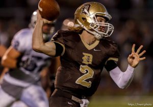 Trent Nelson  |  The Salt Lake Tribune
Davis quarterback Mickey Navidomskis throws the ball on the run as Davis hosts Syracuse High School football in Kaysville, Utah, Friday, September 14, 2012.