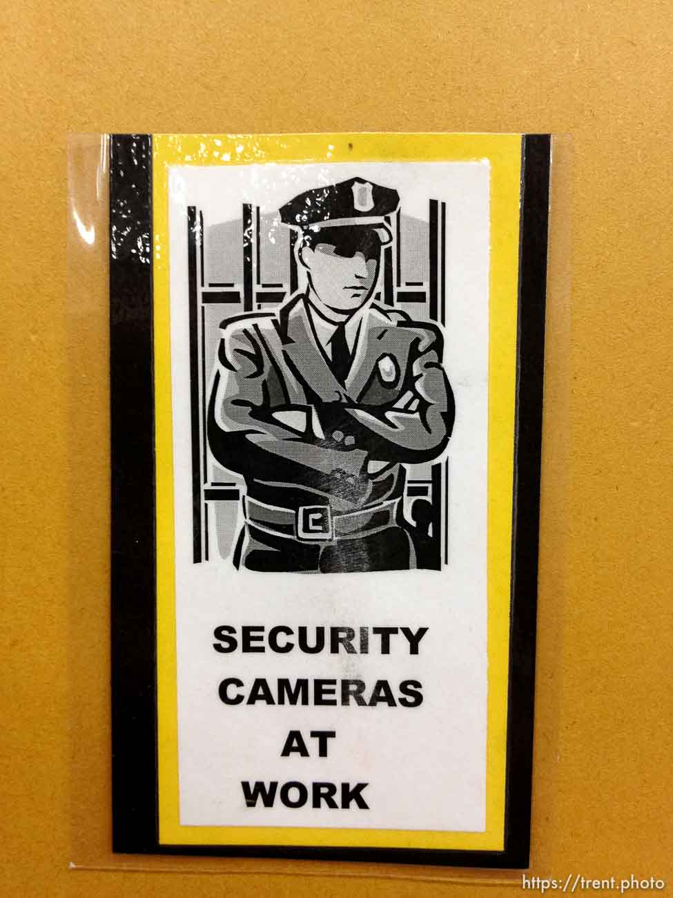 security cameras at work sign