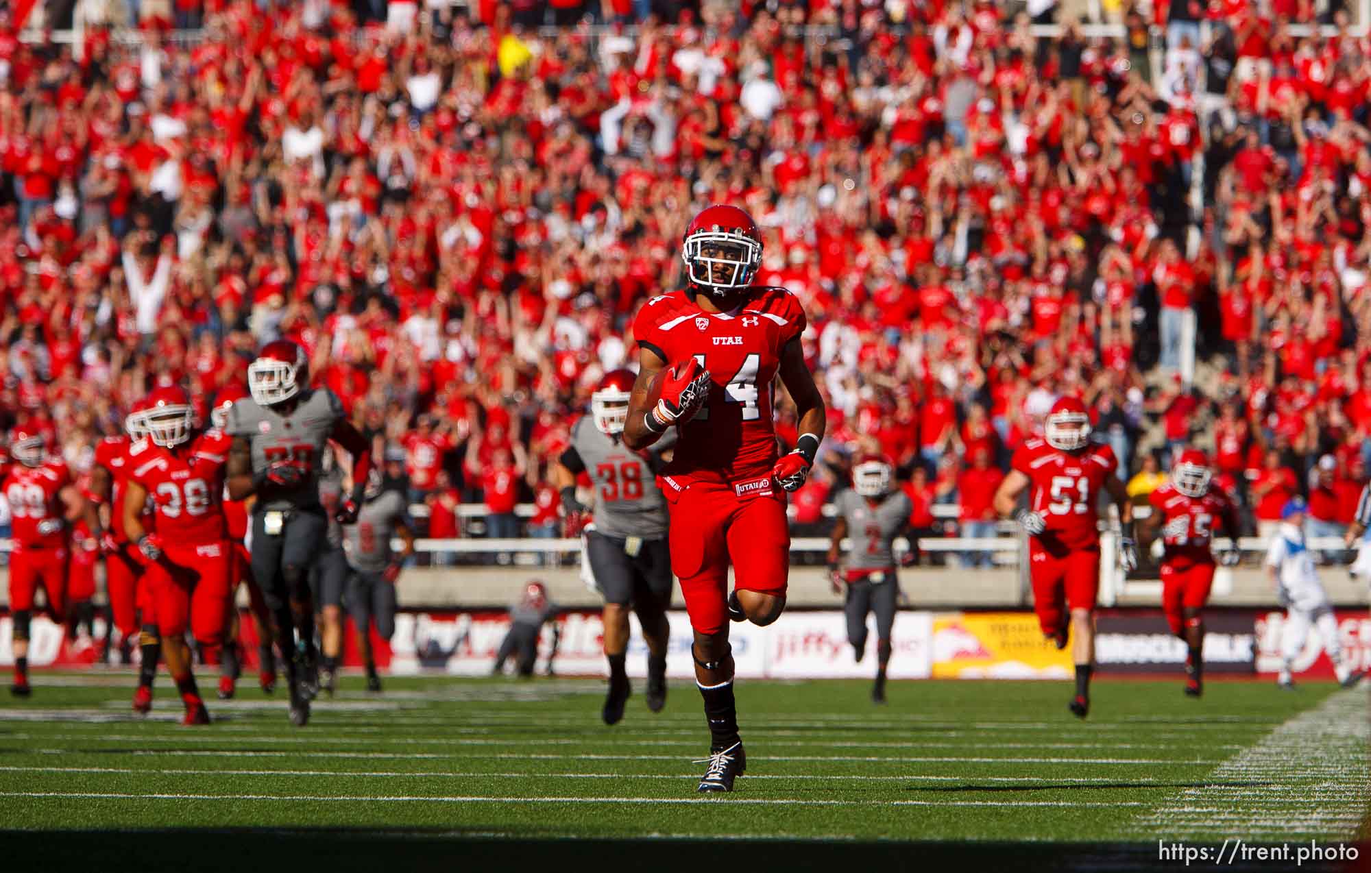 Trent Nelson  |  The Salt Lake Tribune
Utah wide receiver Reggie Dunn (14) sets an NCAA record with his fourth career 100-yard touchdown return as Utah hosts Washington State, college football at Rice-Eccles Stadium Saturday November 3, 2012 in Salt Lake City.