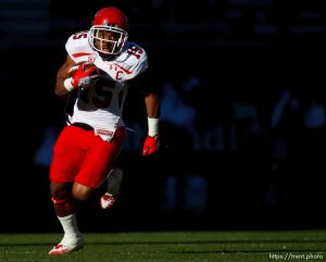 Trent Nelson  |  The Salt Lake Tribune
Utah running back John White runs the ball in the second quarter as the Colorado Buffaloes host the University of Utah Utes, college football Friday November 23, 2012 in Boulder.