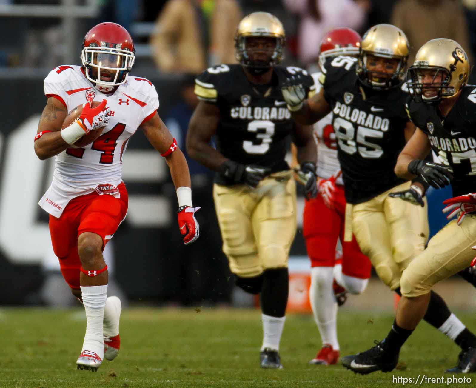 Trent Nelson  |  The Salt Lake Tribune
Utah Utes wide receiver Reggie Dunn (14) returns a kick for a touchdown in the fourth quarter as the Colorado Buffaloes host the University of Utah Utes, college football Friday November 23, 2012 in Boulder.