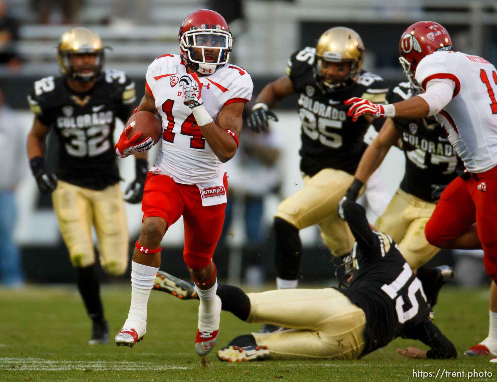 Trent Nelson  |  The Salt Lake Tribune
Utah Utes wide receiver Reggie Dunn (14) returns a kick for a touchdown in the fourth quarter as the Colorado Buffaloes host the University of Utah Utes, college football Friday November 23, 2012 in Boulder.