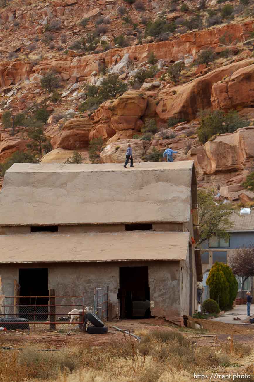 boys on roof of barn, Thursday November 29, 2012.