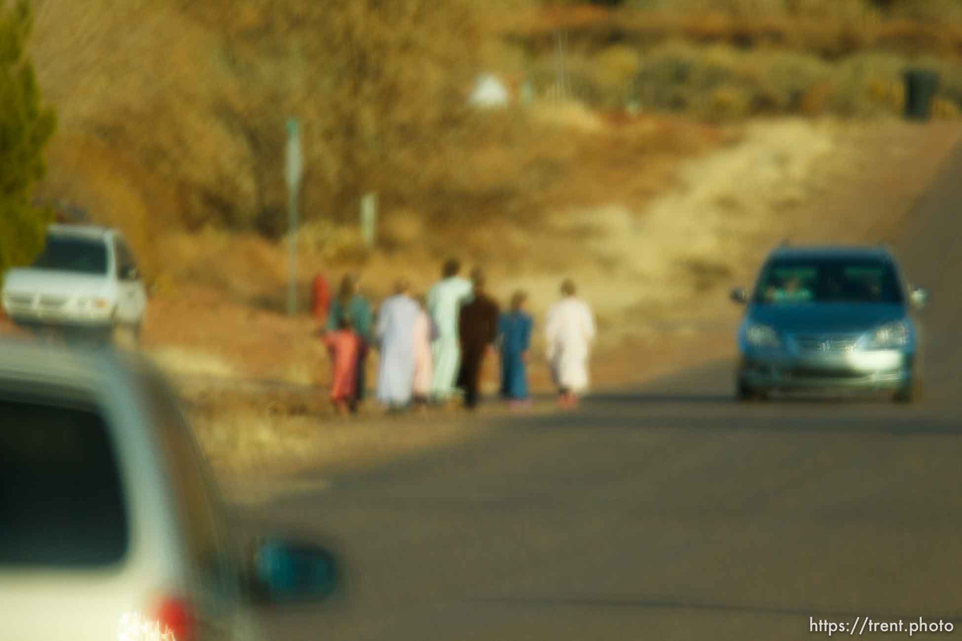 women walking, blurred through windshield, Thursday November 29, 2012.