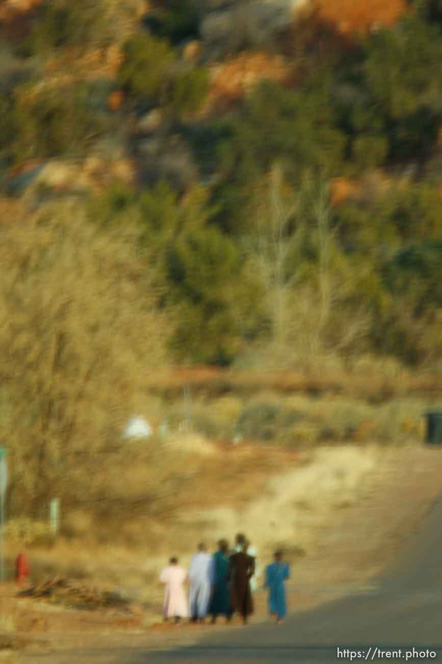 women walking, blurred through windshield, Thursday November 29, 2012.