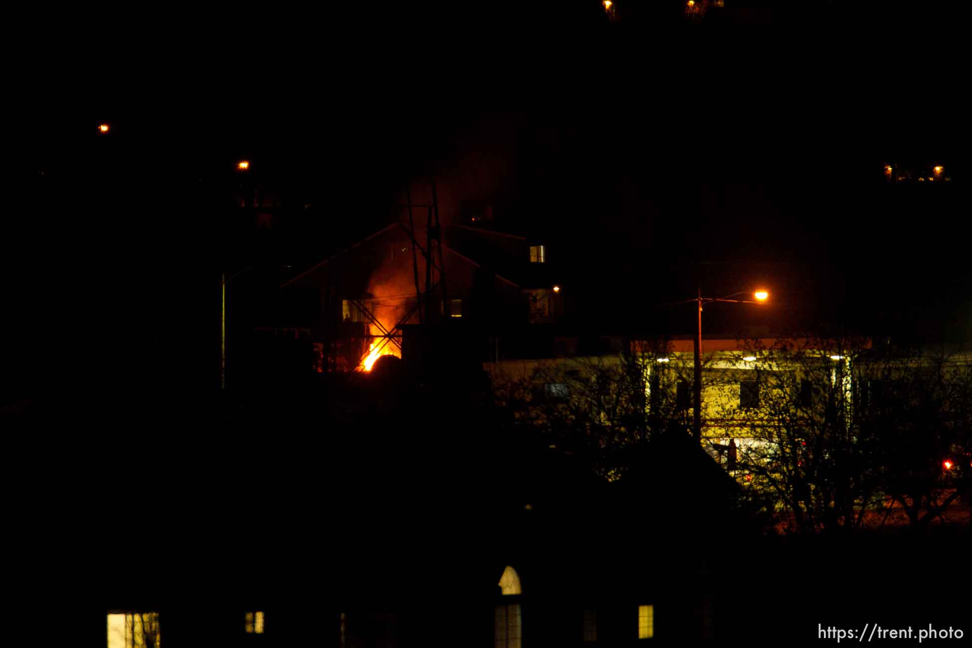 fires burning in town at night, Thursday November 29, 2012.