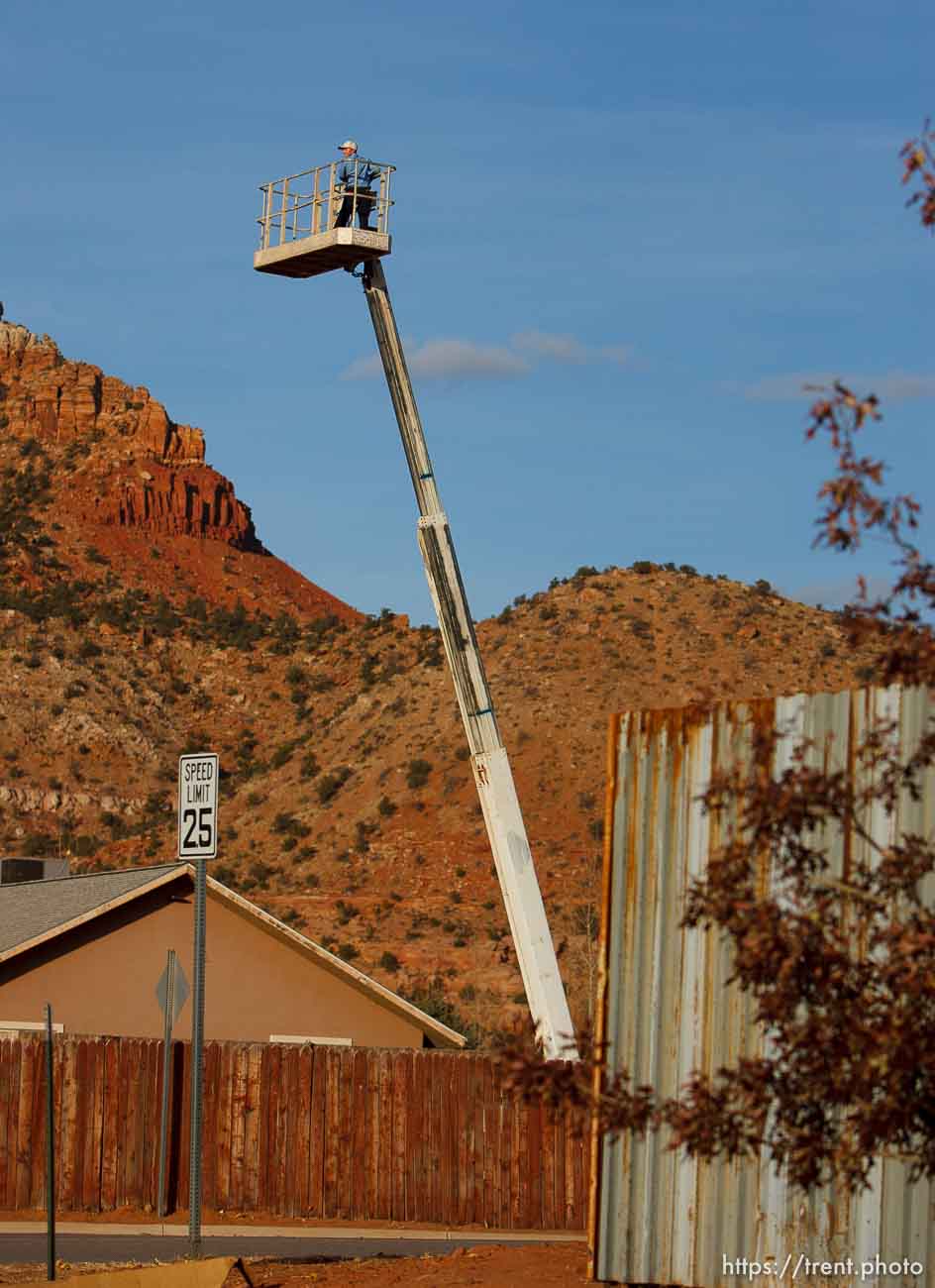 Trent Nelson  |  The Salt Lake Tribune
A young boy on a cherry picker Thursday November 29, 2012 in Hildale.