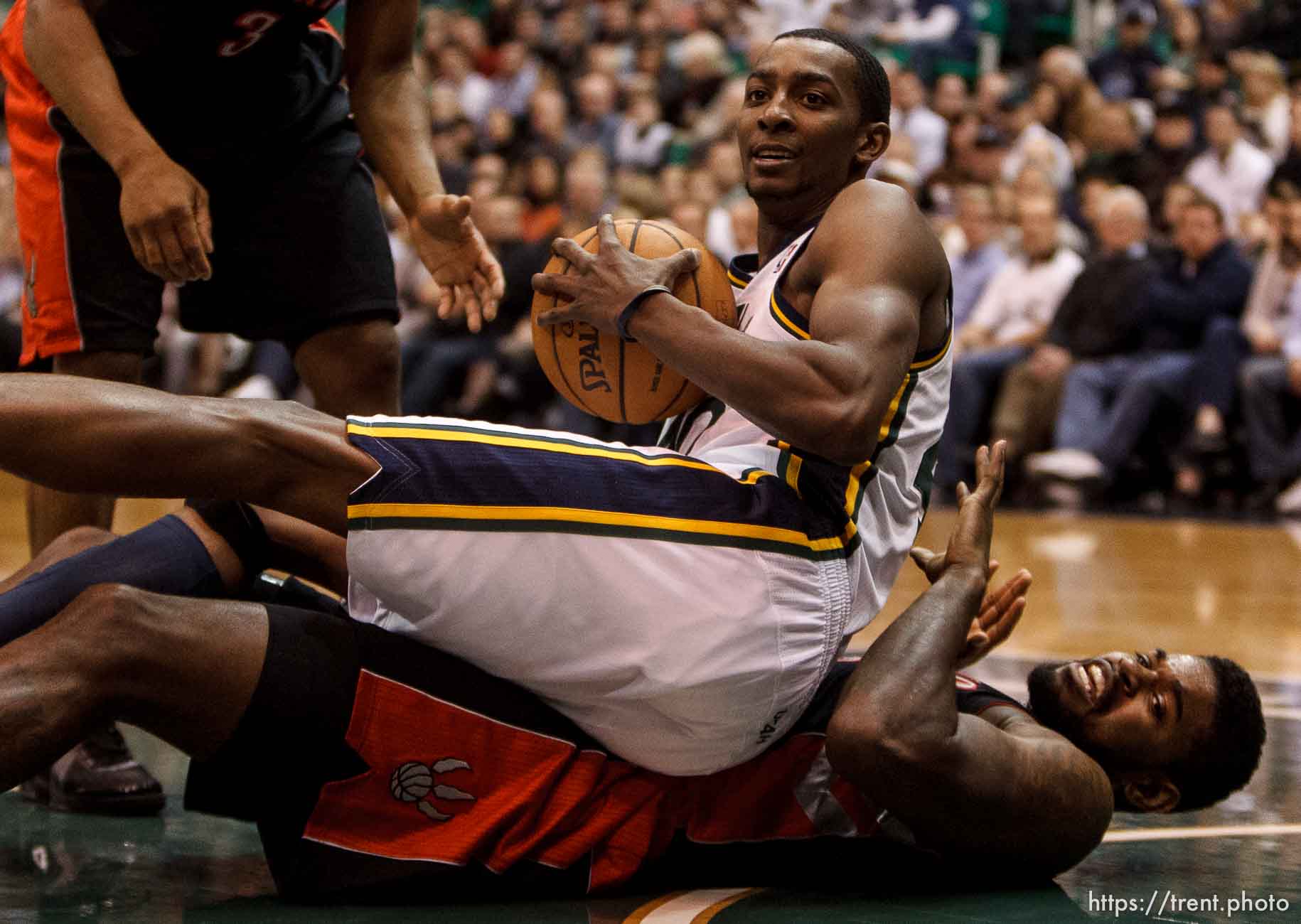 Trent Nelson  |  The Salt Lake Tribune
Utah Jazz small forward Jeremy Evans (40) lands on Toronto Raptors power forward Amir Johnson (15) as the Utah Jazz face the Toronto Raptors Friday December 7, 2012.