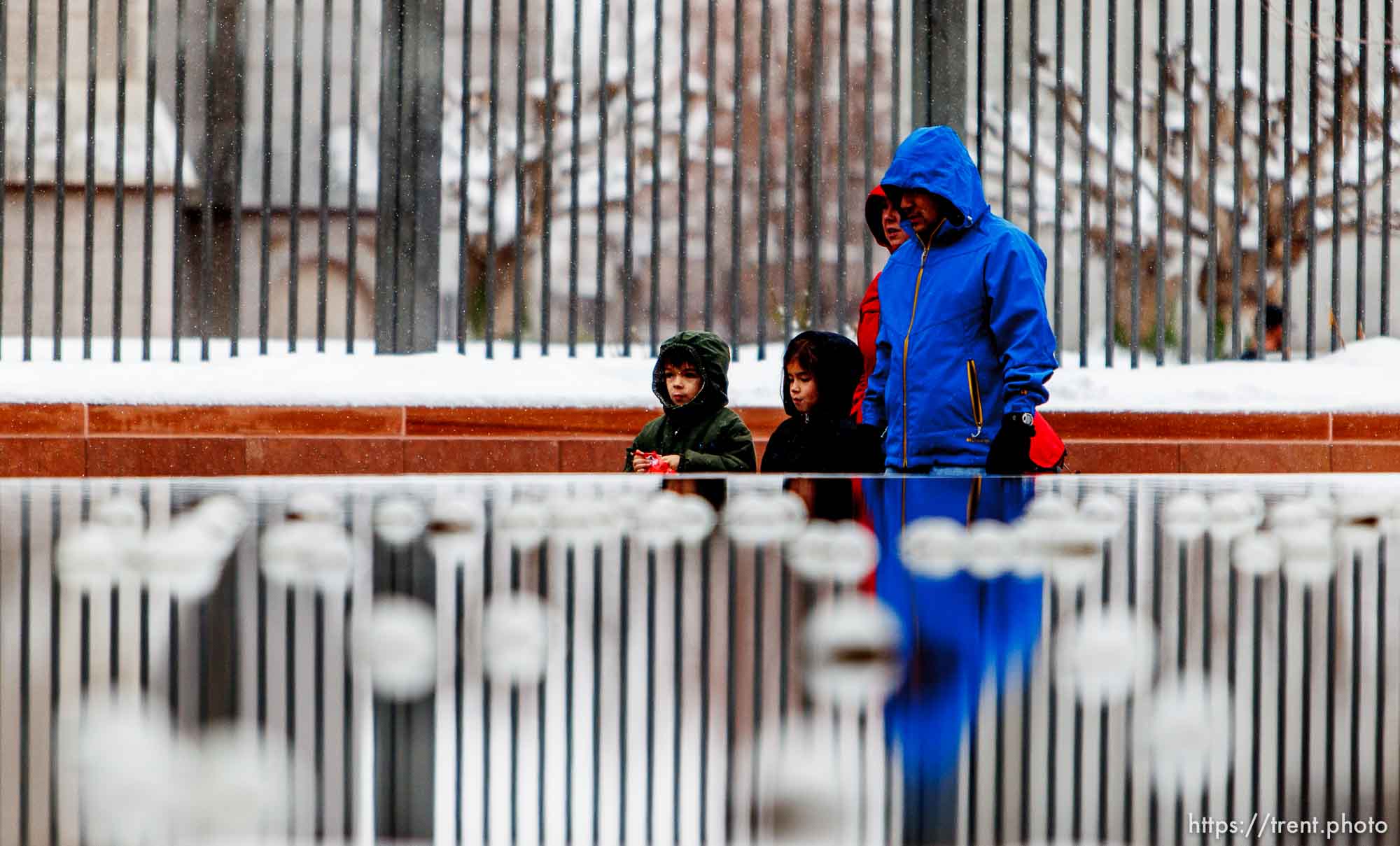 Trent Nelson  |  The Salt Lake Tribune
People walking through a wet Temple Square Wednesday December 26, 2012 in Salt Lake City.