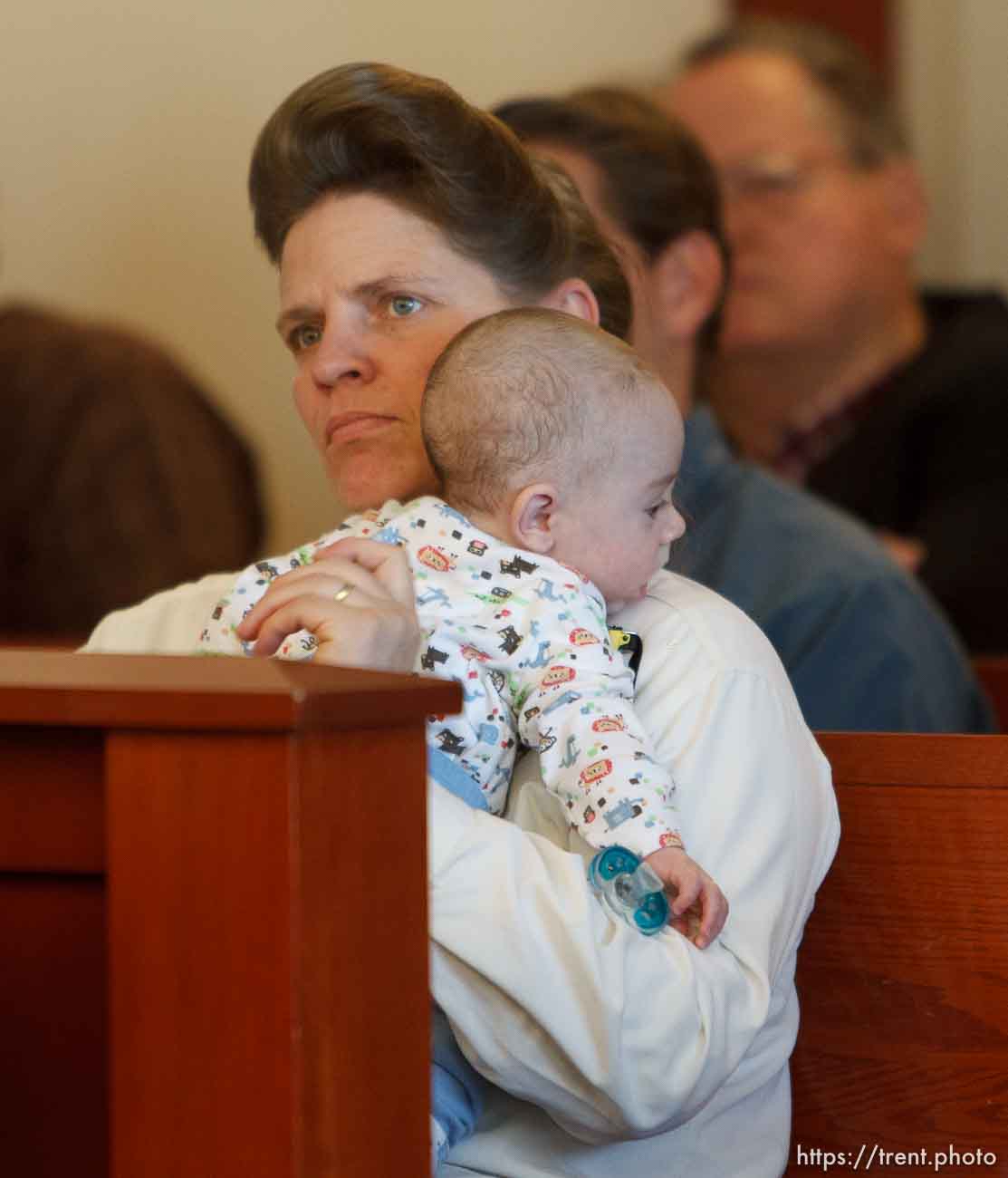 Trent Nelson  |  The Salt Lake Tribune
Joanna Jessop listens while holding an infant during a court hearing on the polygamous UEP land trust, Friday April 12, 2013 in Salt Lake City.