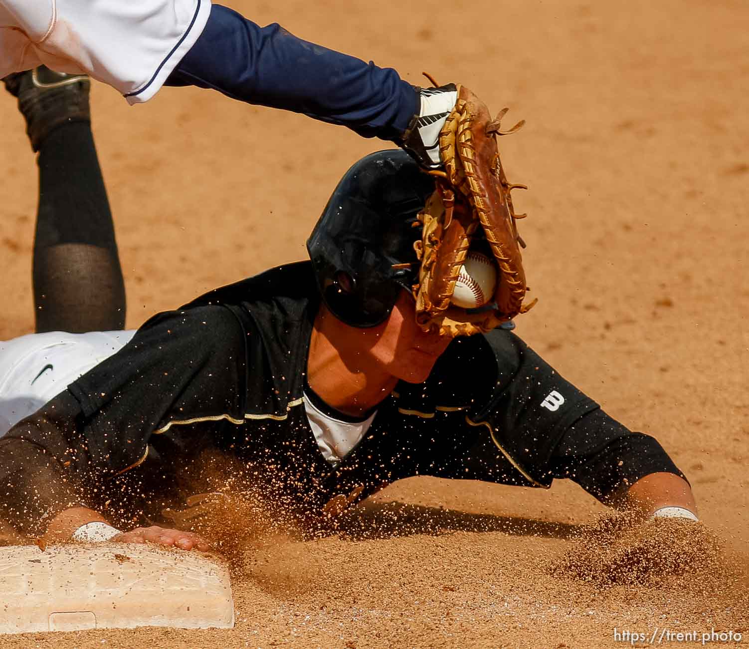 Trent Nelson  |  The Salt Lake Tribune
Desert Hills' Ty Rutlede dives safely back to first despite the tag by Snow Canyon's Riley Gates. Snow Canyon defeated Desert Hills High School for the 3A boys baseball state championship in Orem Saturday May 18, 2013.