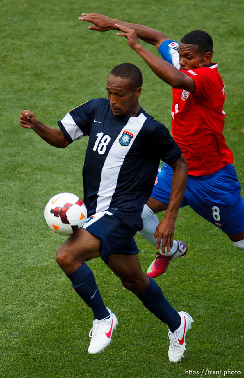 Trent Nelson  |  The Salt Lake Tribune
Belize's Evral Trapp dribbles the ball with Costa Rica's Kenny Cunningham defending as Costa Rica defeats Belize 1-0 in CONCACAF Gold Cup soccer at Rio Tinto Stadium in Sandy, Saturday July 13, 2013.