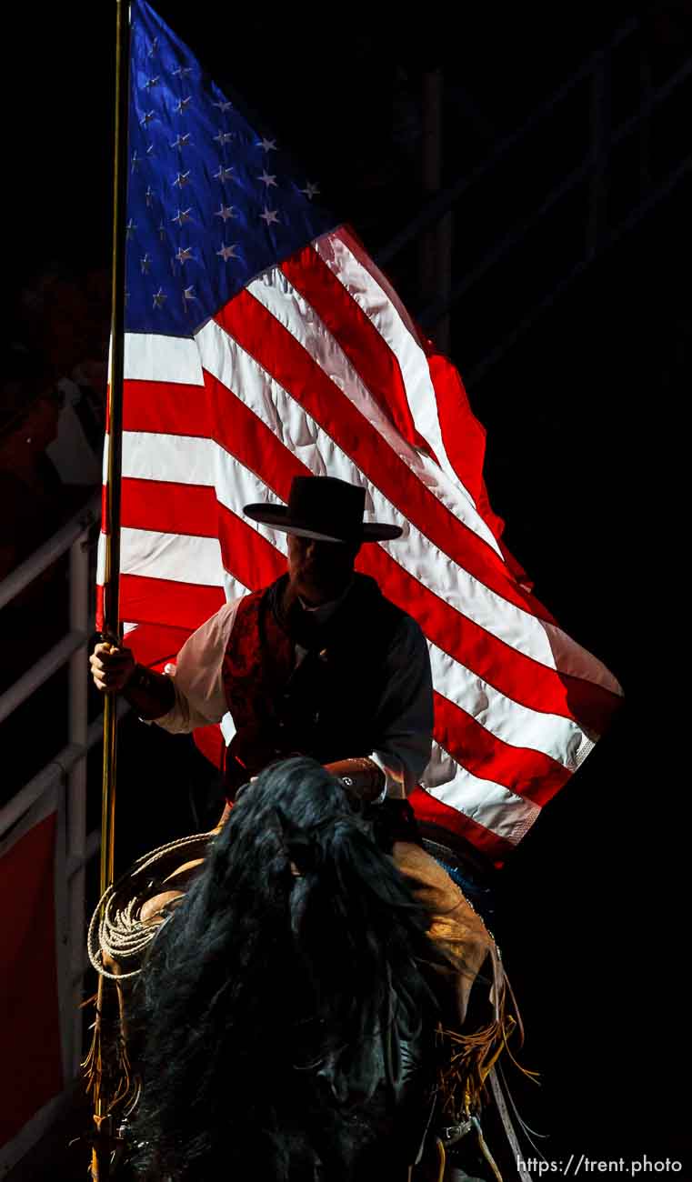 Trent Nelson  |  The Salt Lake Tribune
A rider carries the flag to open the Days of '47 Rodeo at EnergySolutions Arena in Salt Lake City Saturday July 20, 2013.