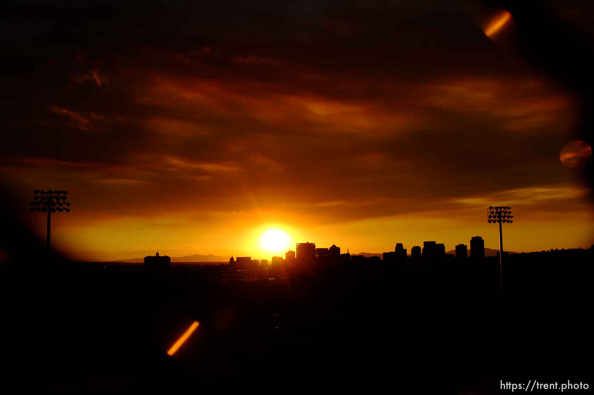 Trent Nelson  |  The Salt Lake Tribune
The sun sets over a smoky Salt Lake City skyline Sunday August 11, 2013.