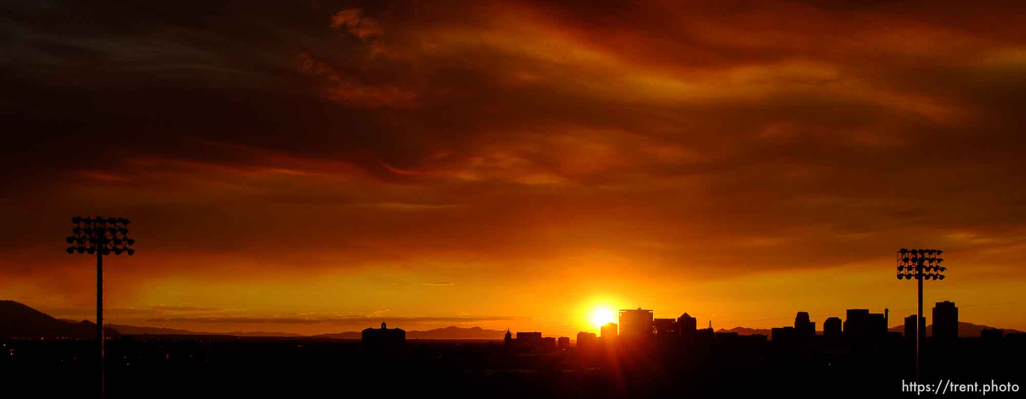 Trent Nelson  |  The Salt Lake Tribune
The sun sets over a smoky Salt Lake City skyline Sunday August 11, 2013.