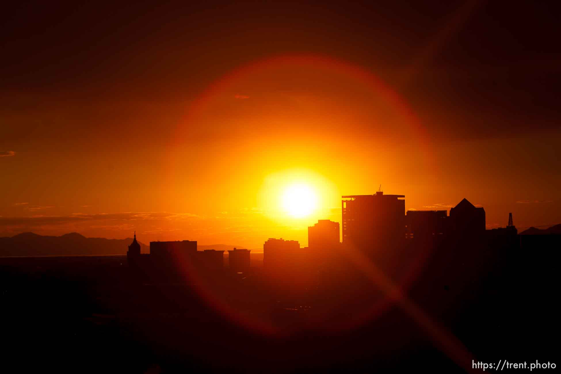 Trent Nelson  |  The Salt Lake Tribune
The sun sets over a smoky Salt Lake City skyline Sunday August 11, 2013.