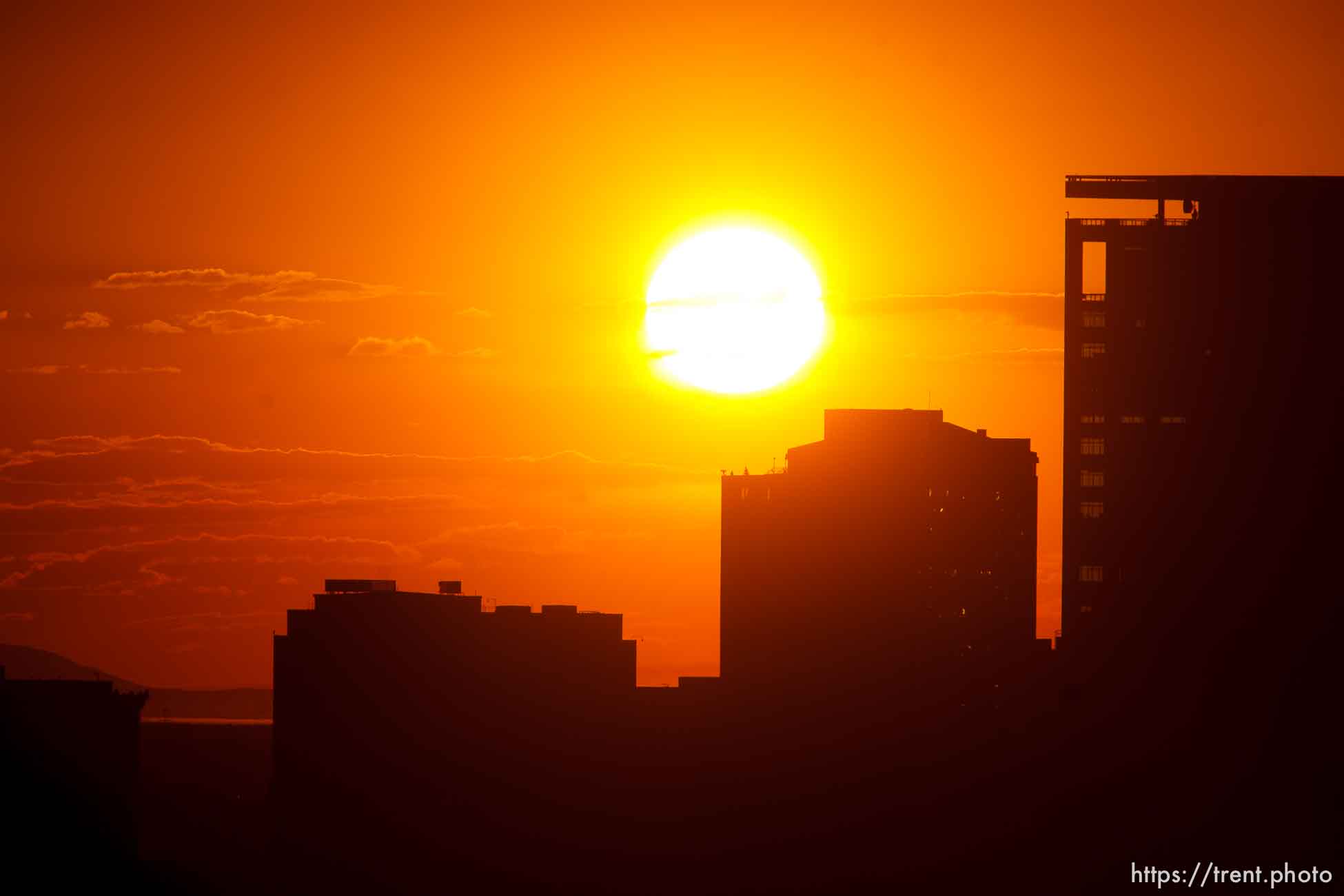 Trent Nelson  |  The Salt Lake Tribune
The sun sets over a smoky Salt Lake City skyline Sunday August 11, 2013.